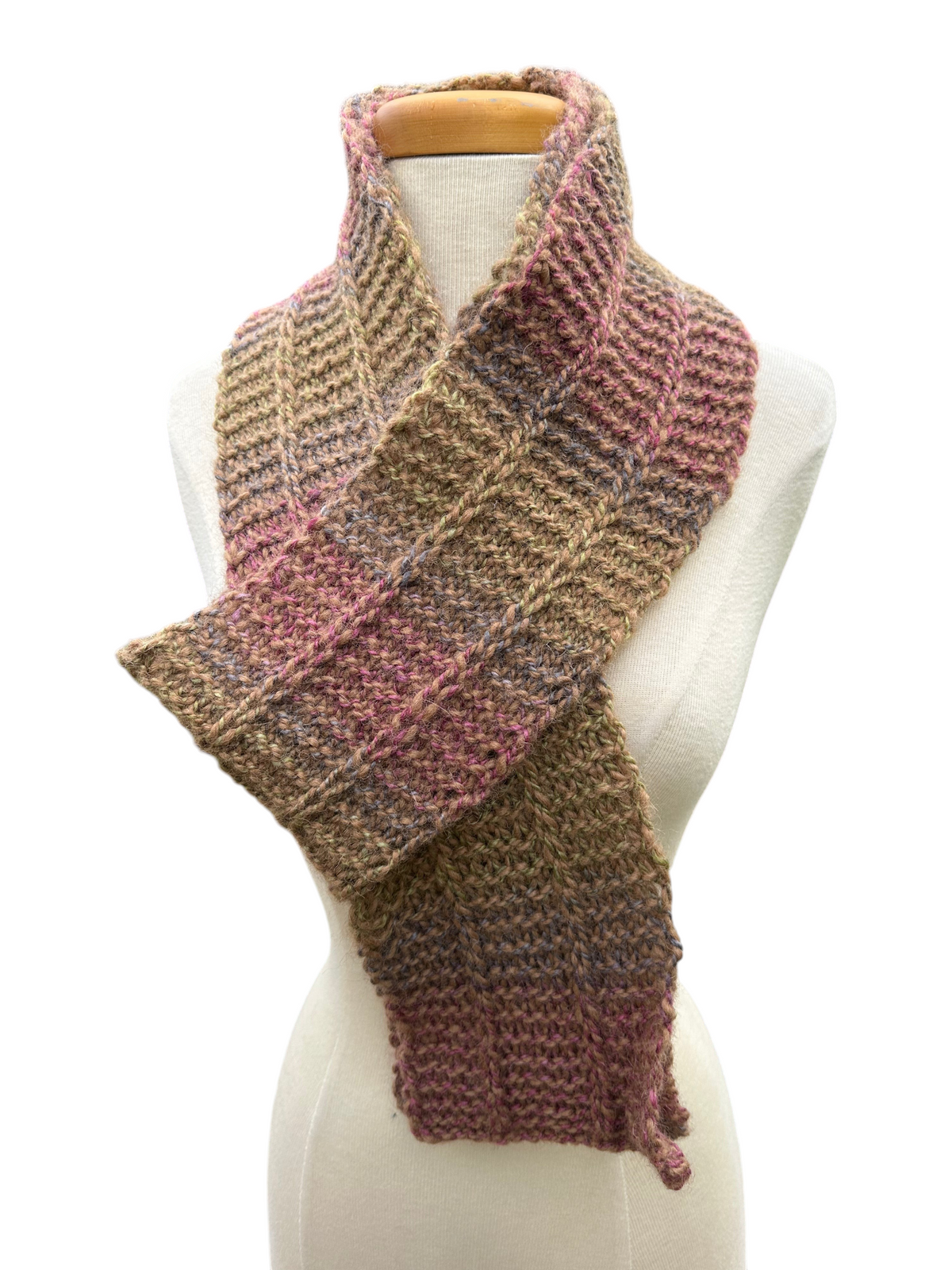Oak Crest Alpacas and More hand knit alpaca and wool scarf in variegated earth tones on a mannequin