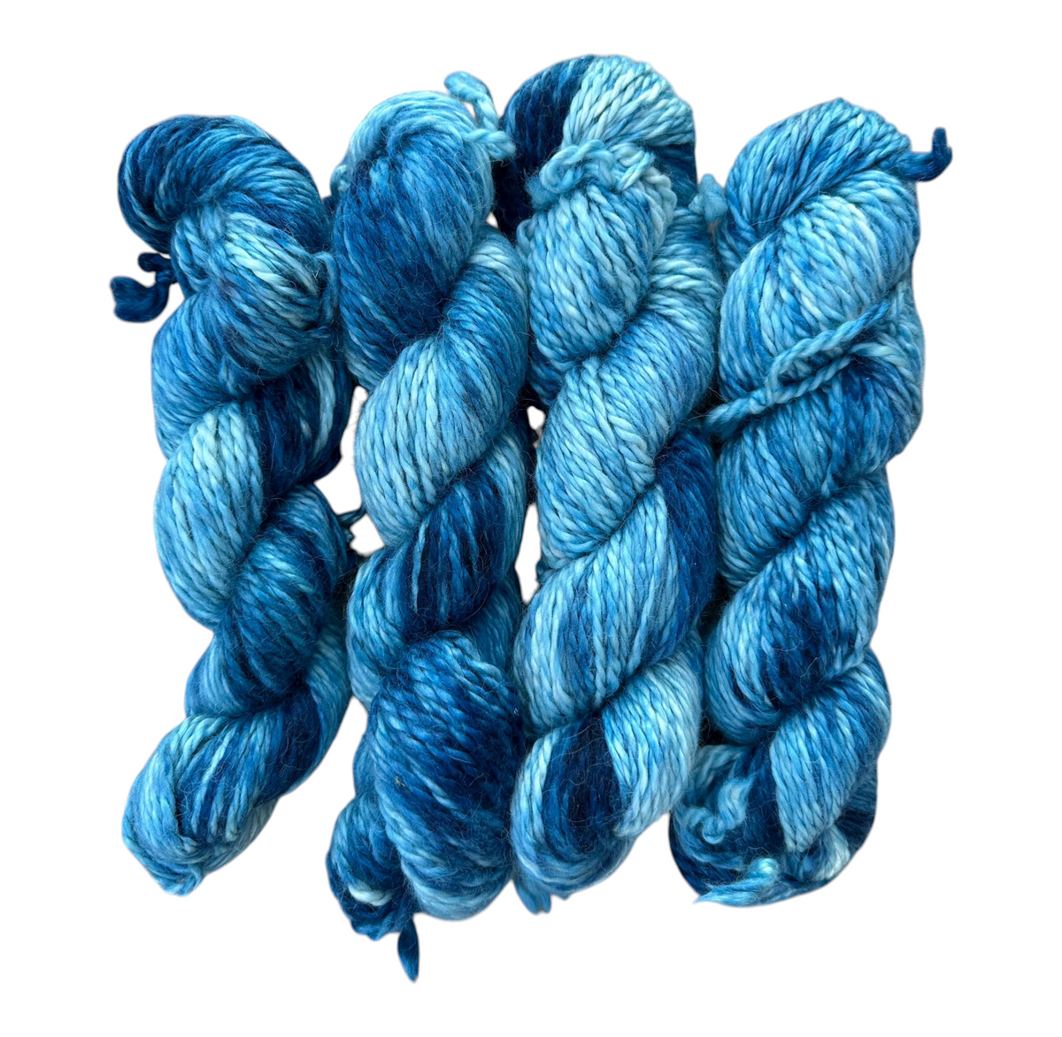 Oak Crest Alpacas and More hand dyed 100% alpaca yarn in variegated indigo blue shades, 109 yards per skein.