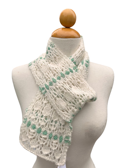 Oak Crest Alpacas and More hand knit white and green lace alpaca scarf on a mannequin