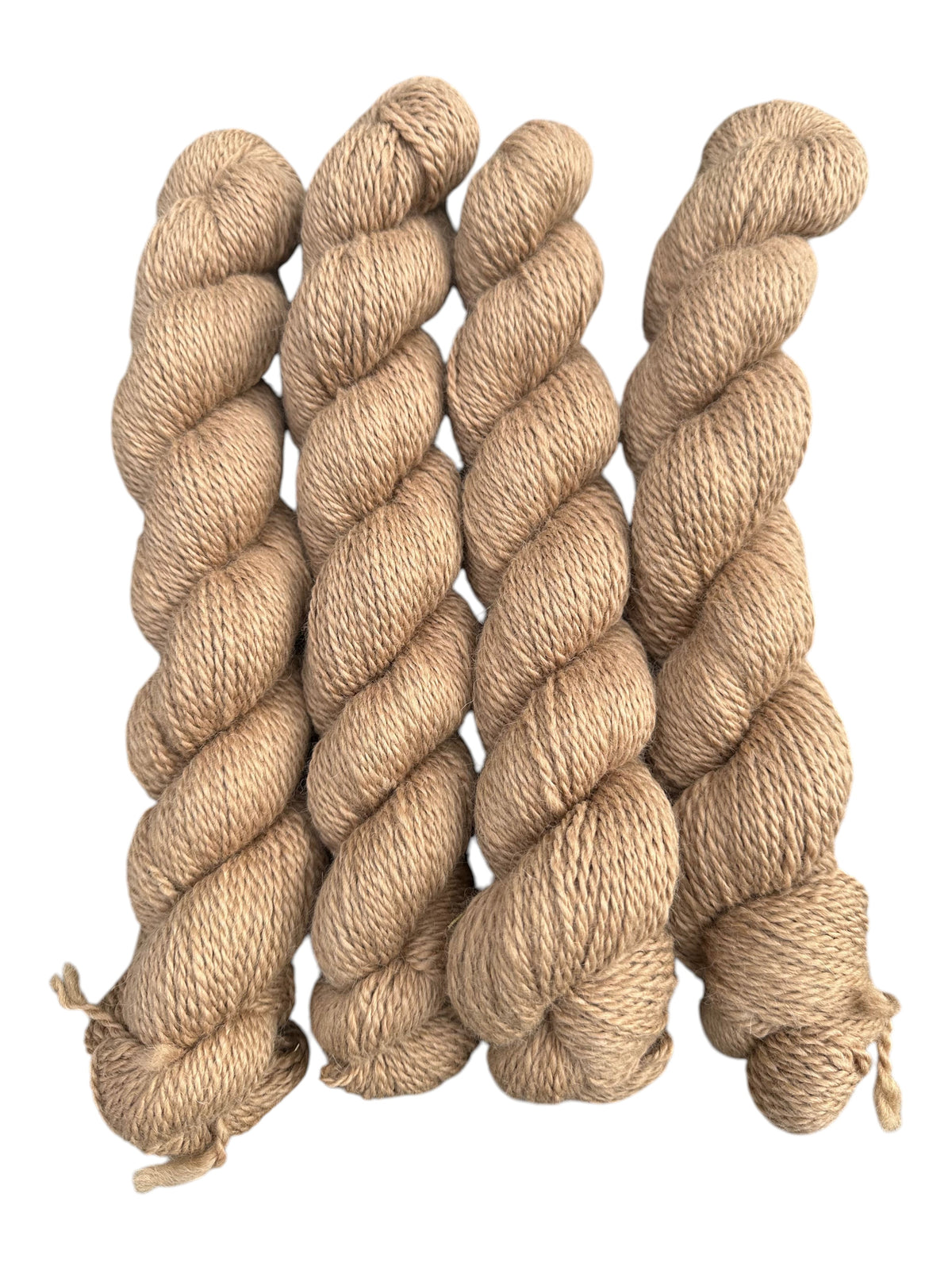Oak Crest Alpacas and More 2 ply DK weight alpaca yarn skeins in a natural light fawn color