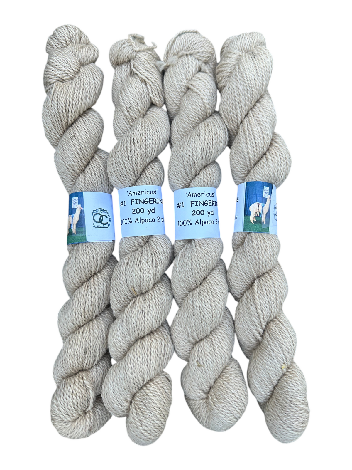 Oak Crest Alpacas and More light fawn 100% alpaca fingering weight yarn skeins, undyed and dehaired natural fiber.