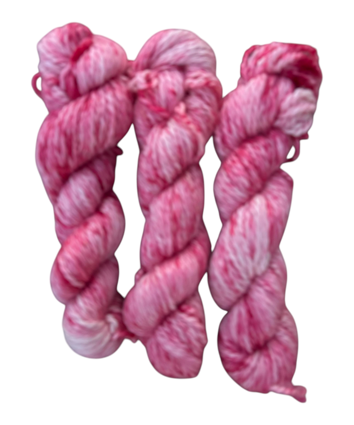 Oak Crest Alpacas and More hand dyed pink orchid alpaca yarn skeins with variegated white and pink texture