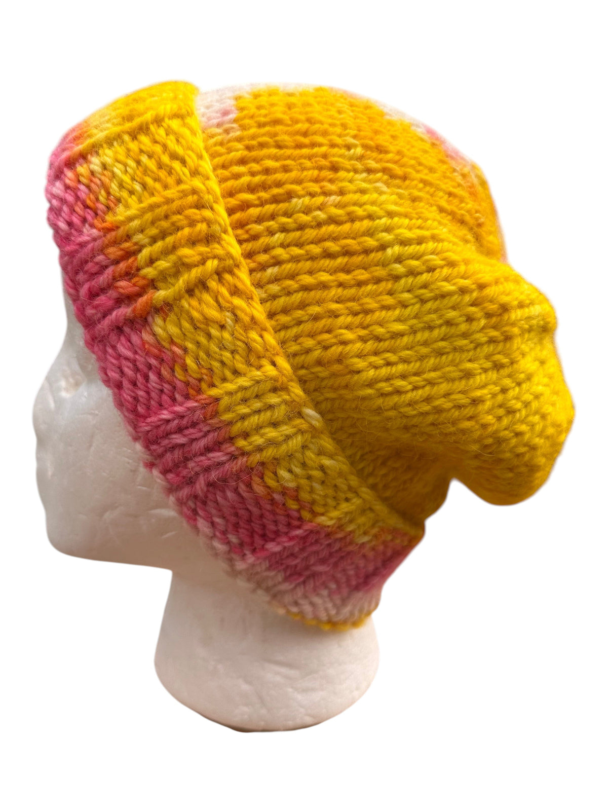 Oak Crest Alpacas and More hand knit pink and yellow alpaca wool slouchy beanie hat on a mannequin head