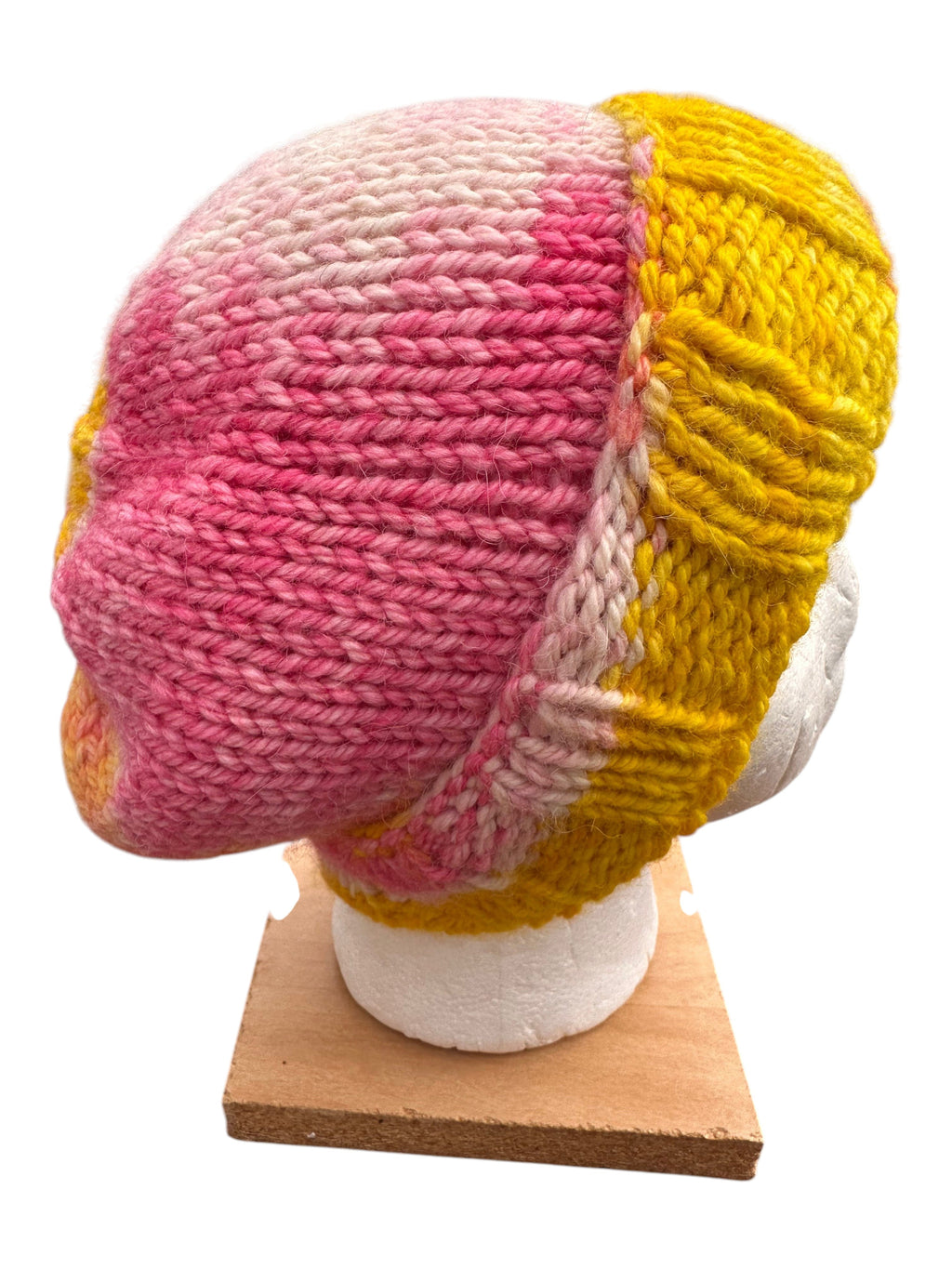 Oak Crest Alpacas and More hand knit pink and yellow alpaca wool slouch beanie hat on a display head