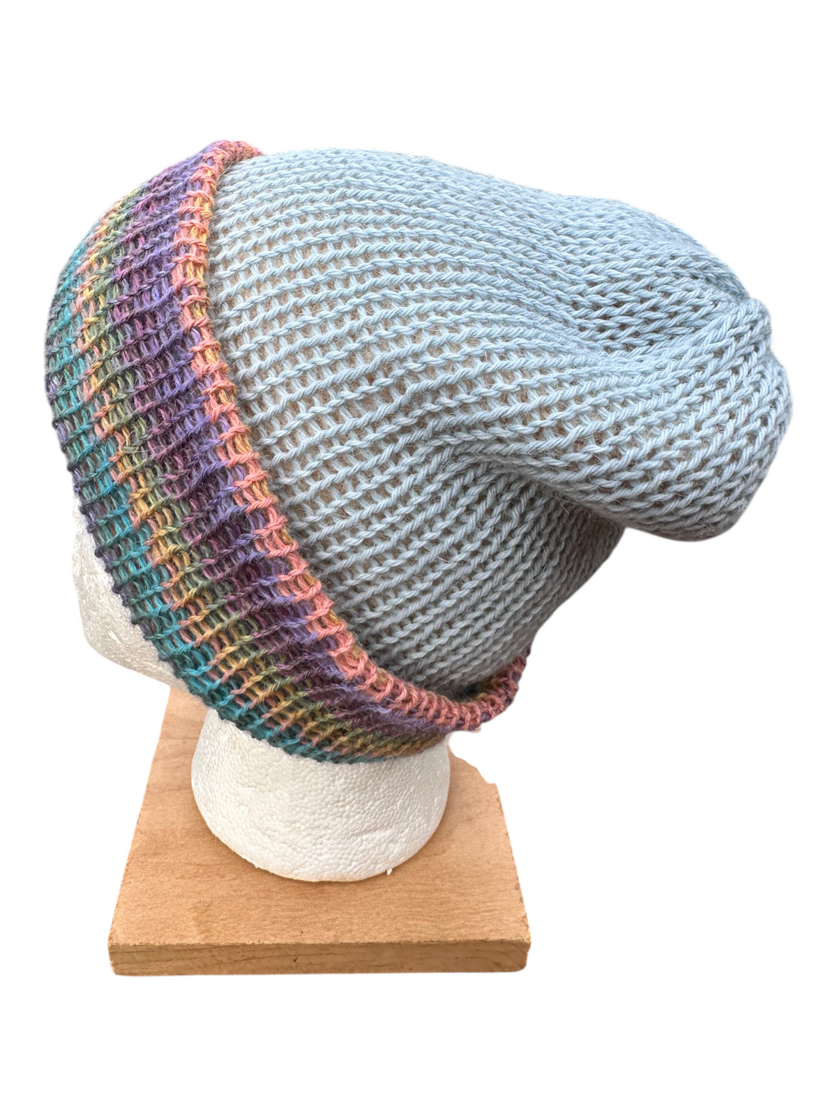 Oak Crest Alpacas and More reversible double knit alpaca hat in blue with a multi-colored peach and teal fold over brim