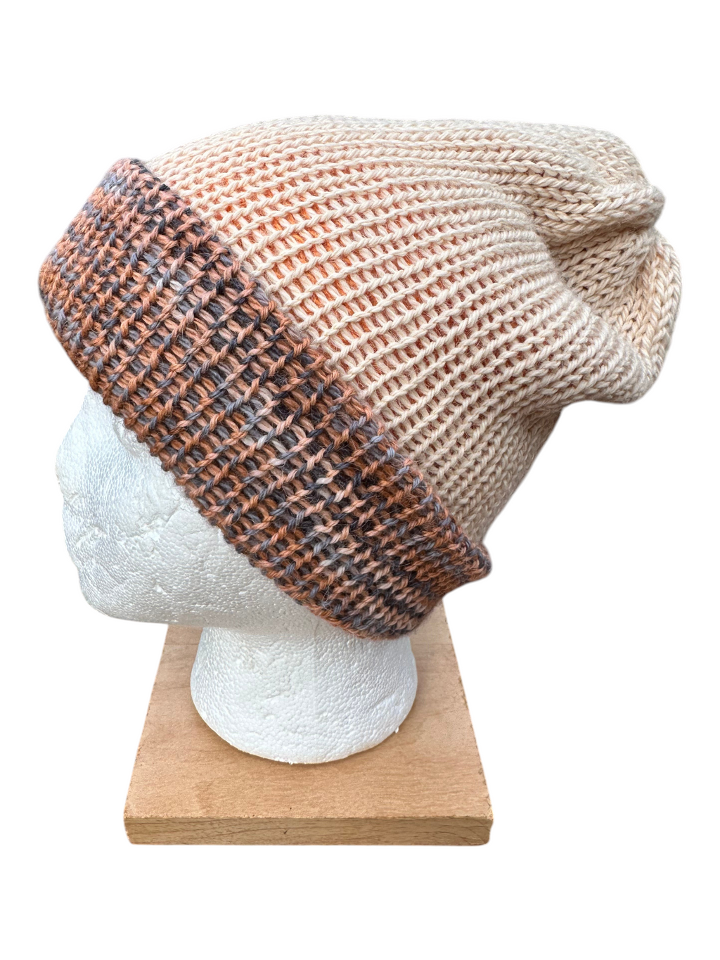 Oak Crest Alpacas and More reversible double knit alpaca hat in peach and multi-colored yarn with a folded brim