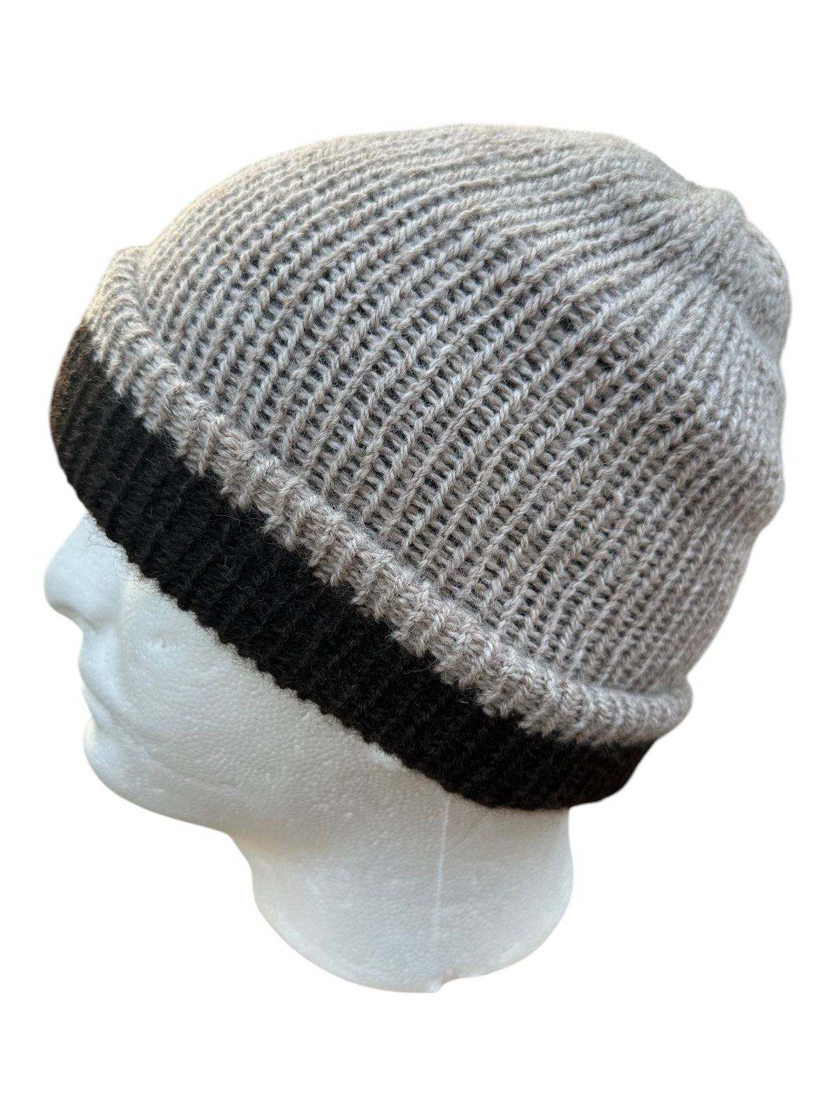 Oak Crest Alpacas and More reversible double knit alpaca hat in gray and black with a fold over brim on a mannequin