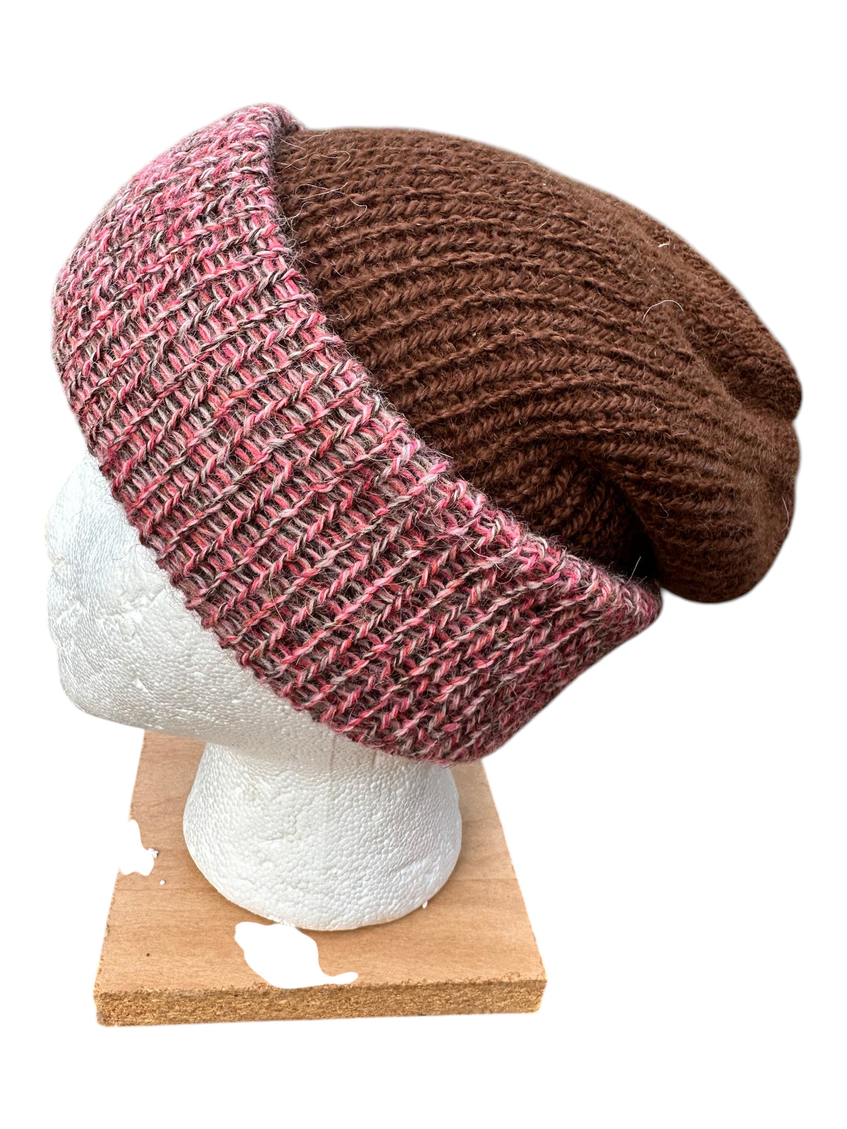 Oak Crest Alpacas and More reversible double knit alpaca hat in brown and pink marled yarn on a mannequin head