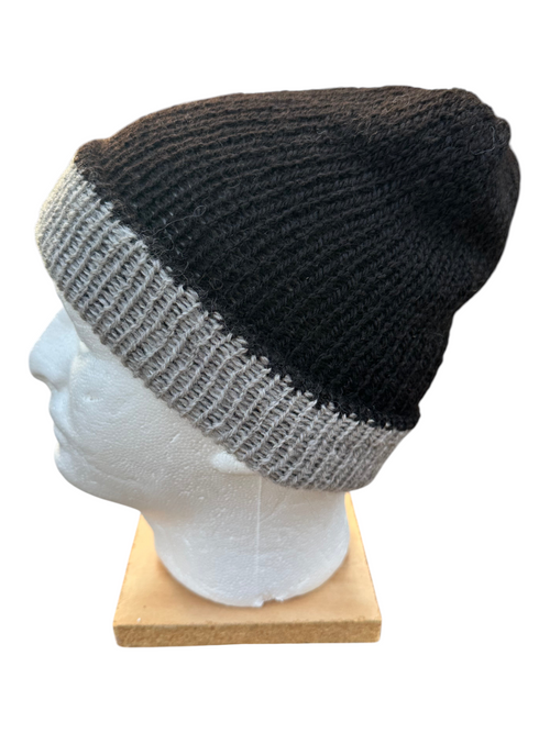 Oak Crest Alpacas and More reversible double knit alpaca hat in black and gray on a mannequin head
