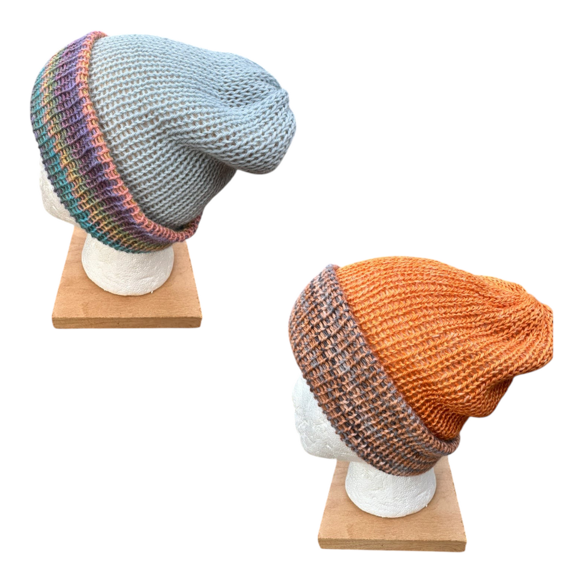 Oak Crest Alpacas and More reversible double knit alpaca hats in blue and orange on mannequin heads