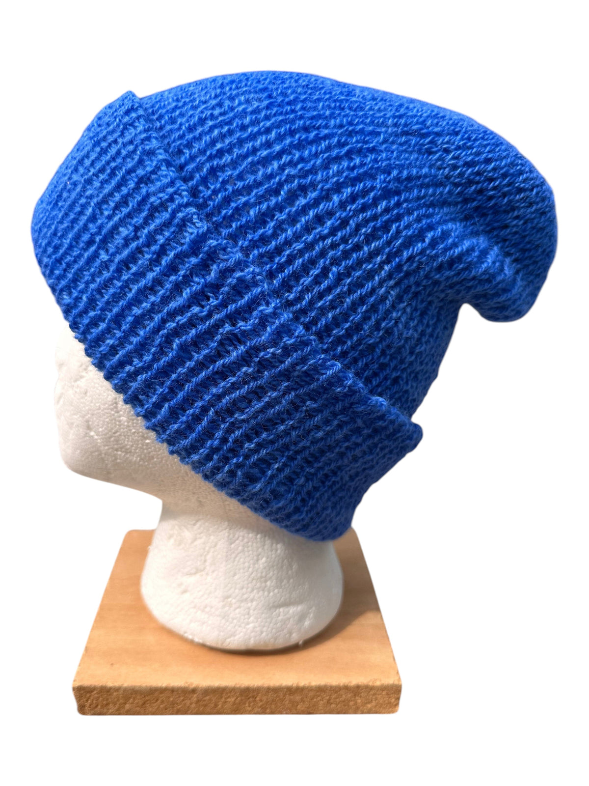 Oak Crest Alpacas and More royal blue reversible 100% alpaca knit hat with a fold over brim on a mannequin head