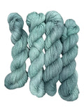 Oak Crest Alpacas and More hand-dyed worsted weight 100% American alpaca yarn in a soft sage green 2-ply skein.