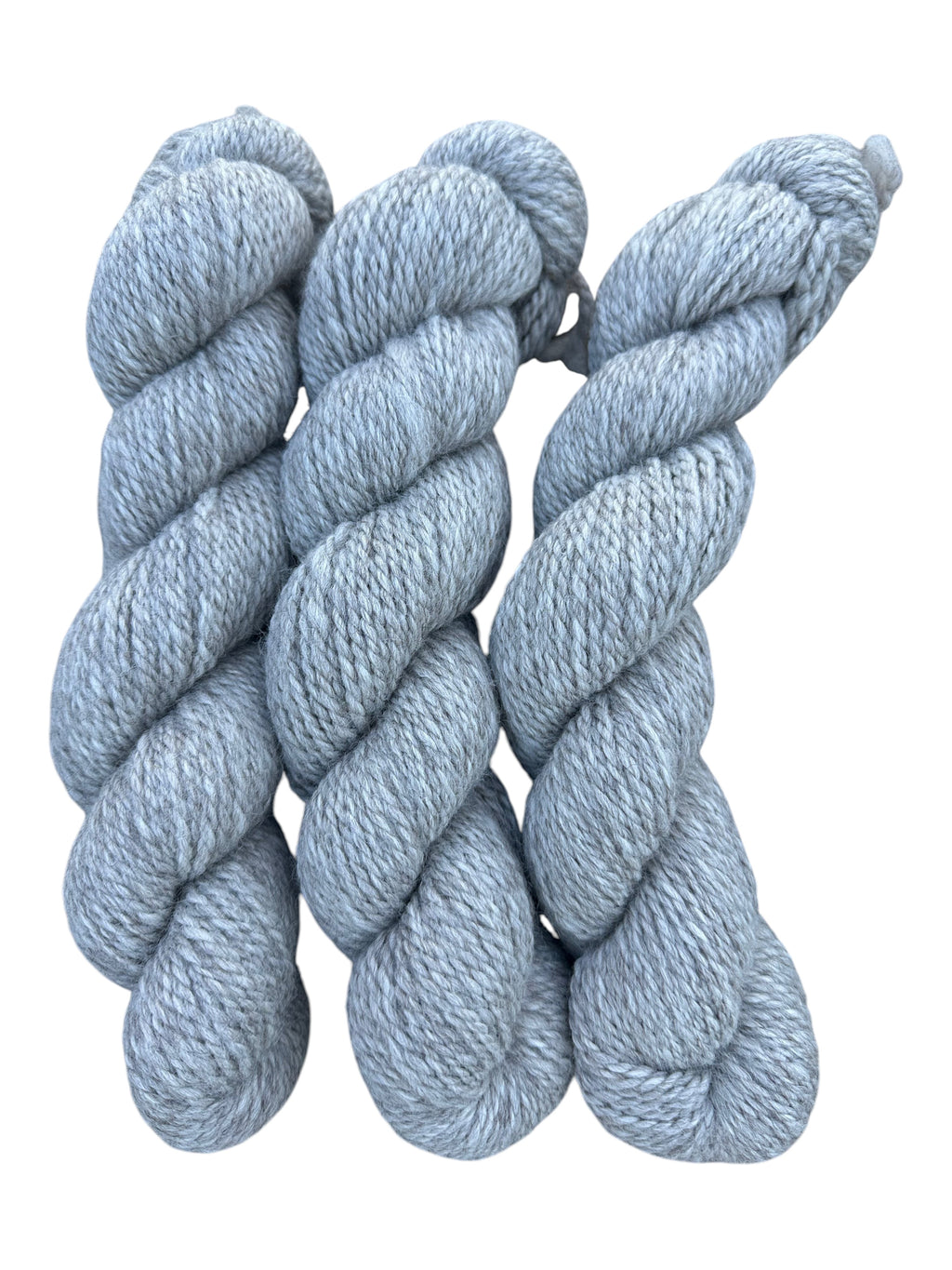 Oak Crest Alpacas and More chunky 2-ply silver gray alpaca yarn skeins, dehaired for extra softness.