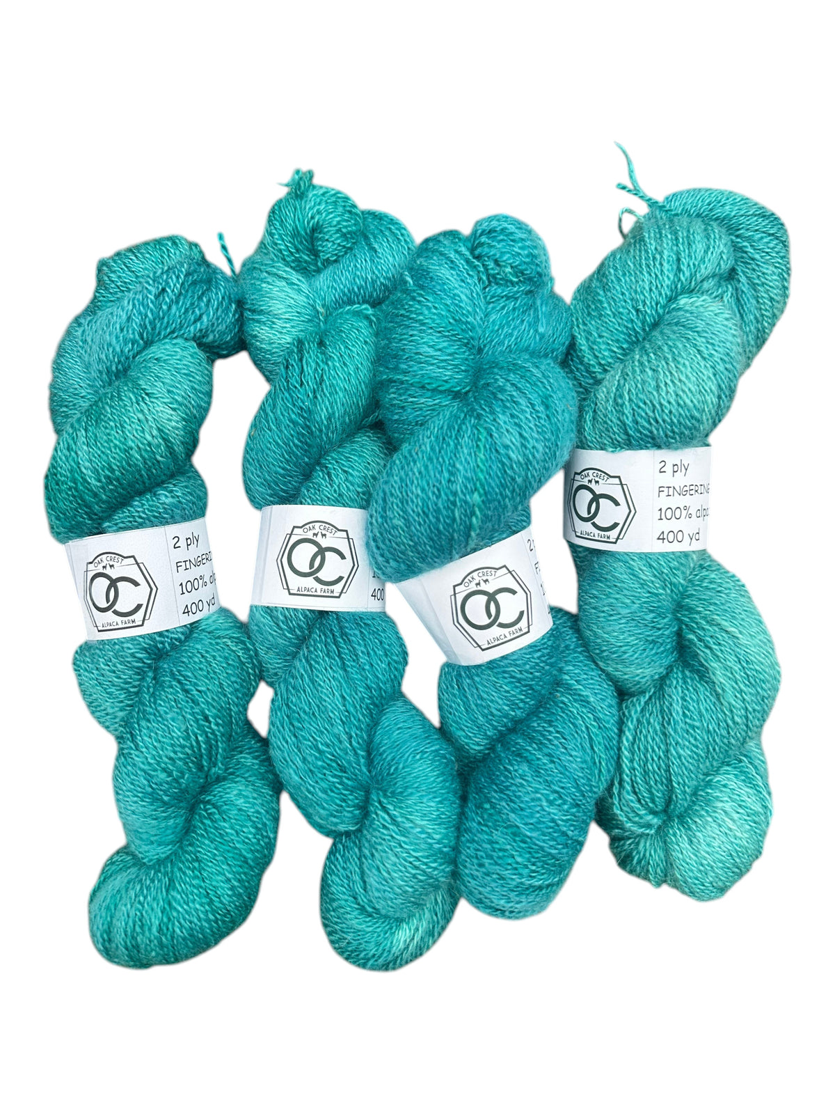Four skeins of Oak Crest Alpacas and More hand-dyed teal fingering weight 100% American alpaca yarn