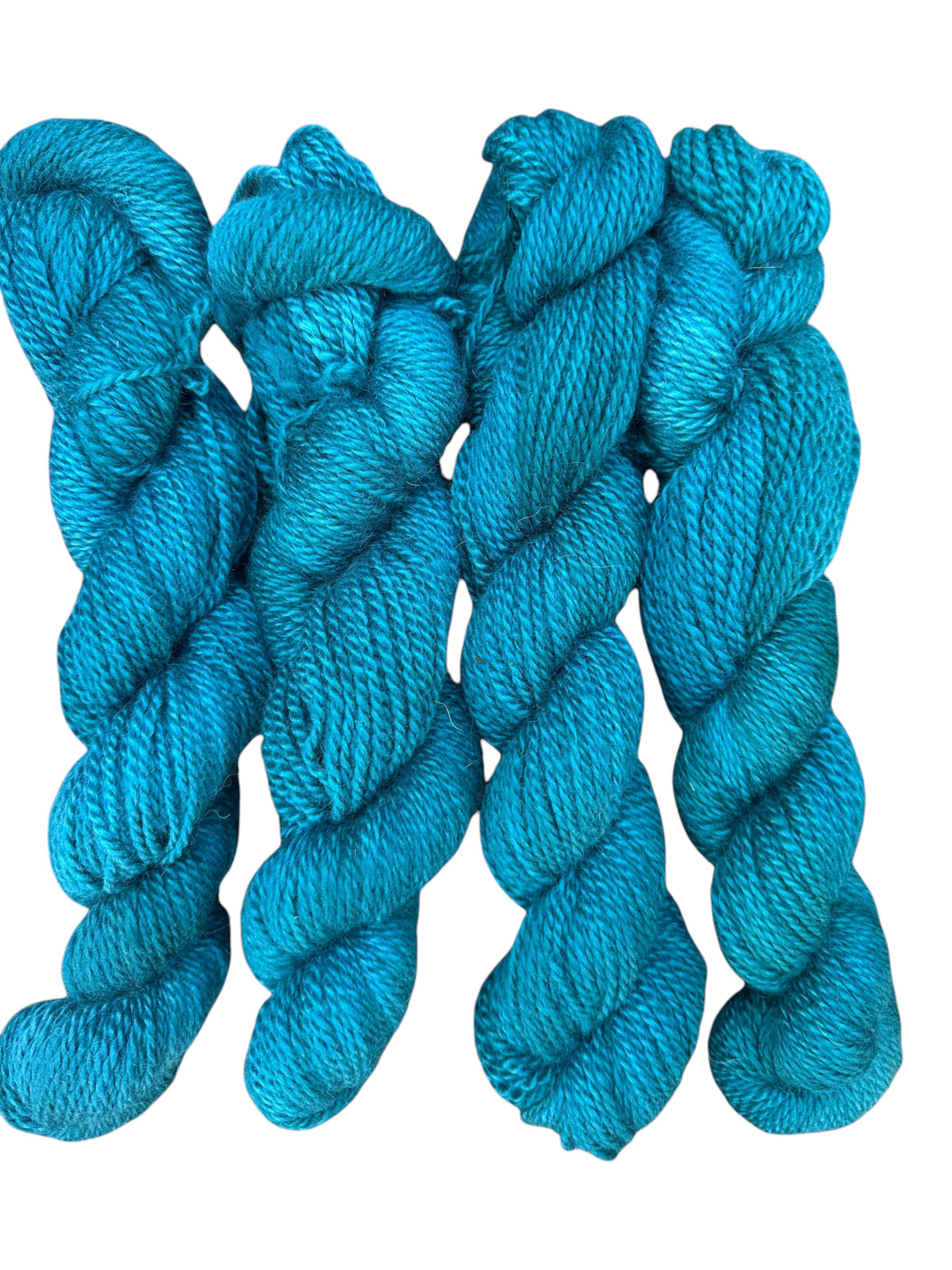 Oak Crest Alpacas and More hand dyed worsted weight 100% American alpaca yarn in a vibrant teal blue 2-ply skein