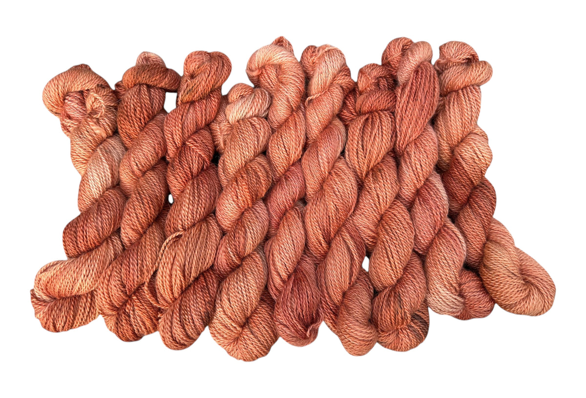 Oak Crest Alpacas and More hand-dyed worsted weight 100% American alpaca yarn in a warm terracotta orange hue.