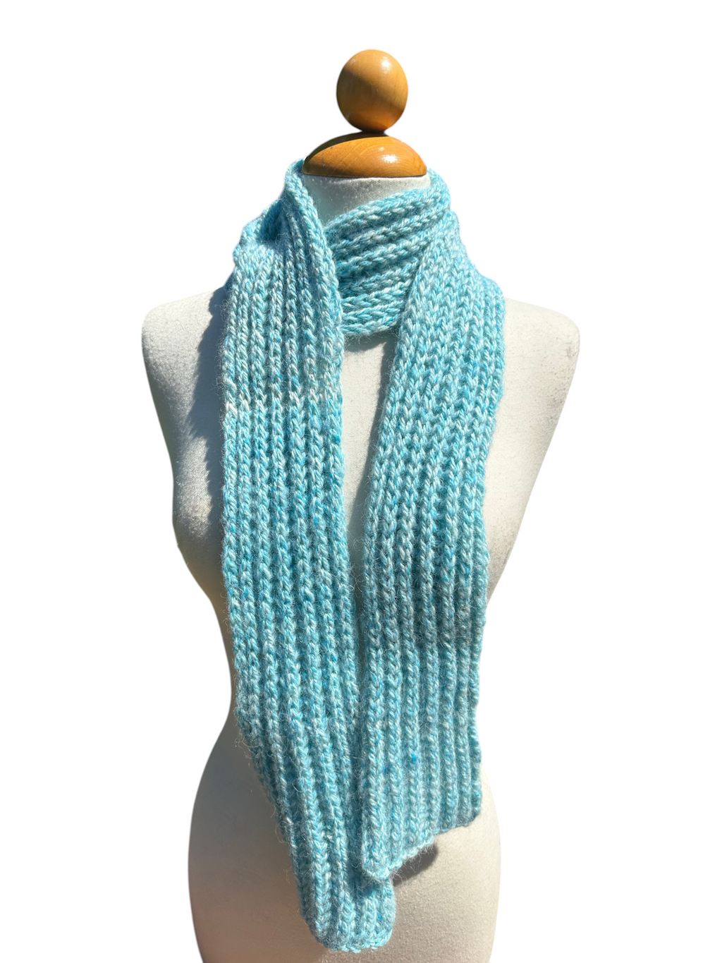 Oak Crest Alpacas and More hand knit turquoise alpaca scarf on a mannequin, soft and warm textured winter accessory.