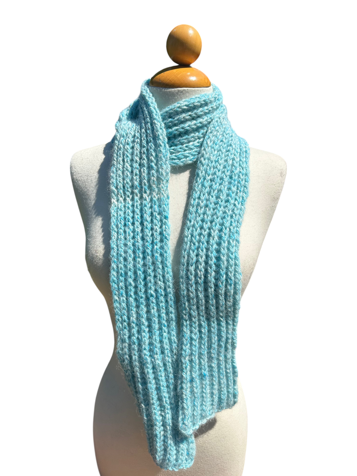 Oak Crest Alpacas and More hand knit turquoise alpaca scarf on a mannequin, soft and warm textured winter accessory.