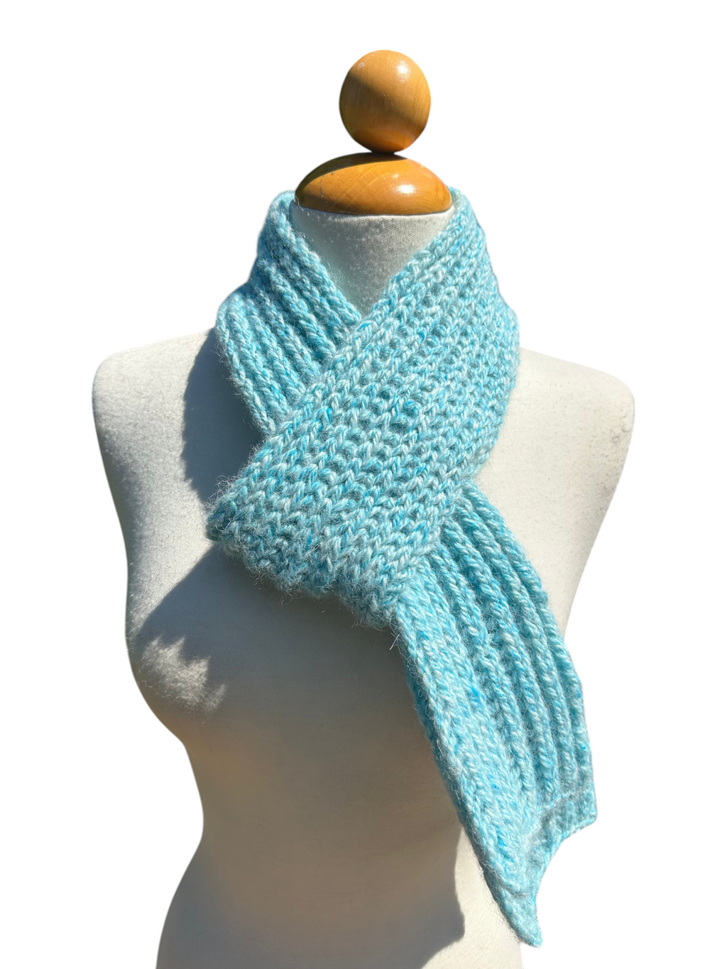 Oak Crest Alpacas and More hand knit tonal turquoise alpaca scarf on a mannequin, soft and warm winter accessory.