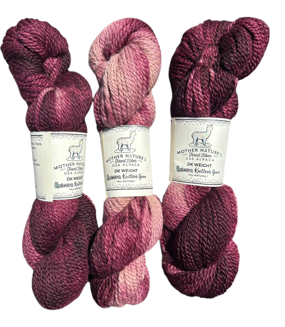 Oak Crest Alpacas and More variegated DK weight yarn in shades of pink and purple, 70% alpaca and 30% merino wool.