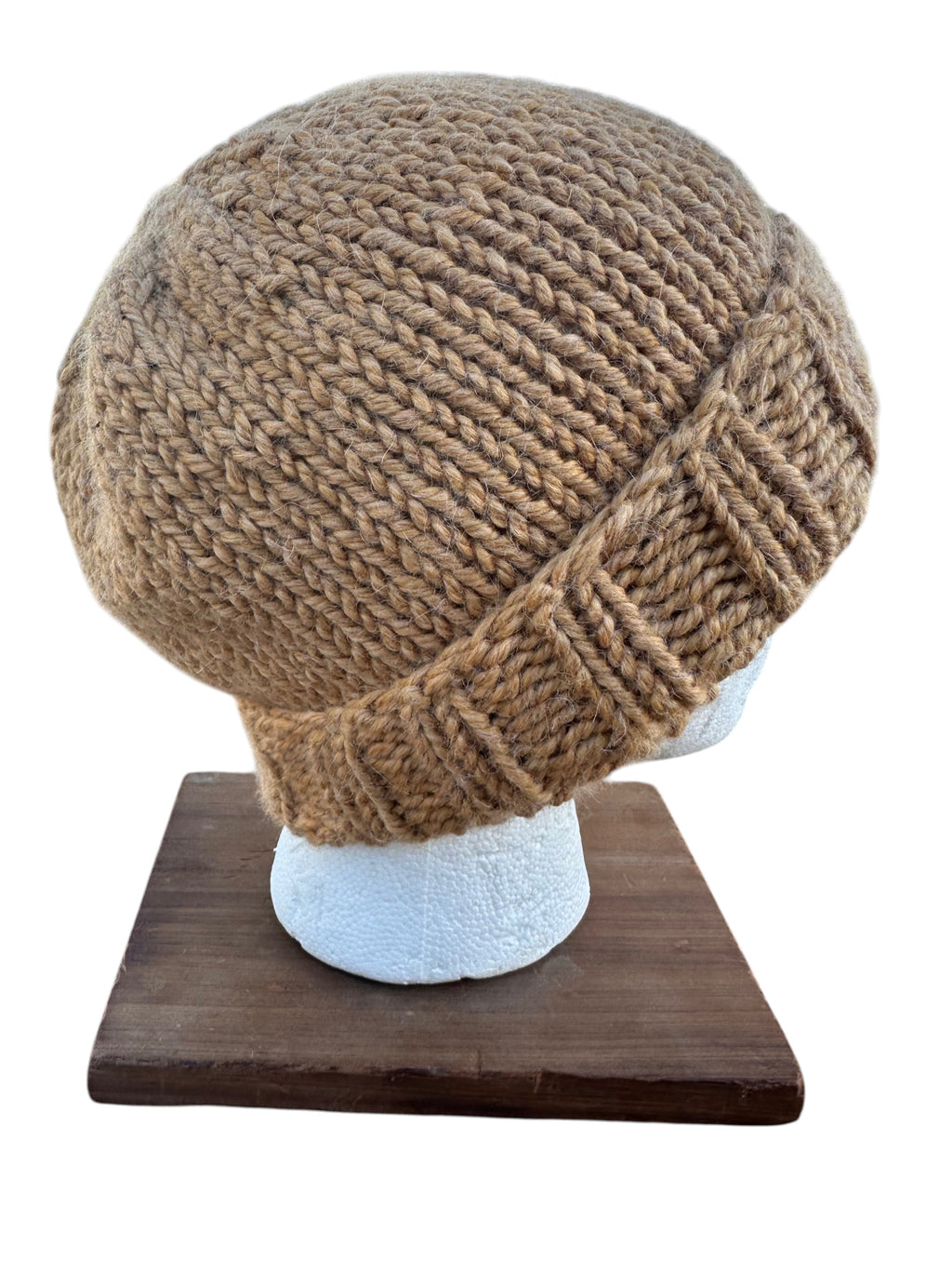 Oak Crest Alpacas and More hand-knit wheat chunky alpaca wool beanie with a foldable brim on a display head