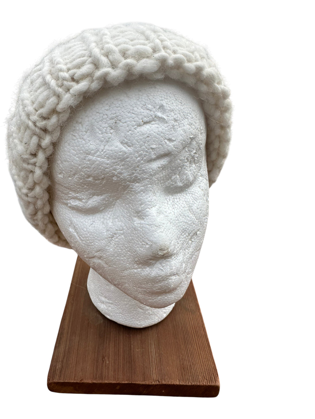 Oak Crest Alpacas and More white hand-knit chunky alpaca wool beanie with a fold-over brim on a mannequin head.