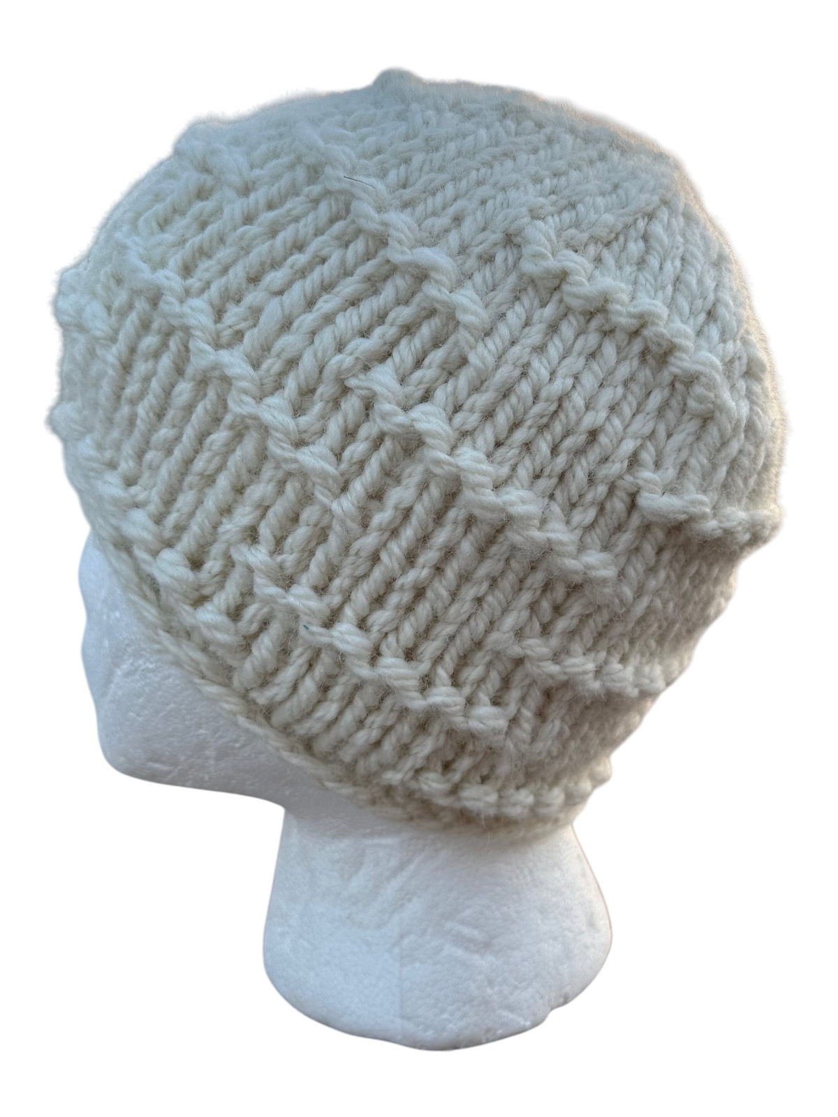 Oak Crest Alpacas and More white hand-knit chunky alpaca wool hat with a textured broken ridge pattern on a mannequin