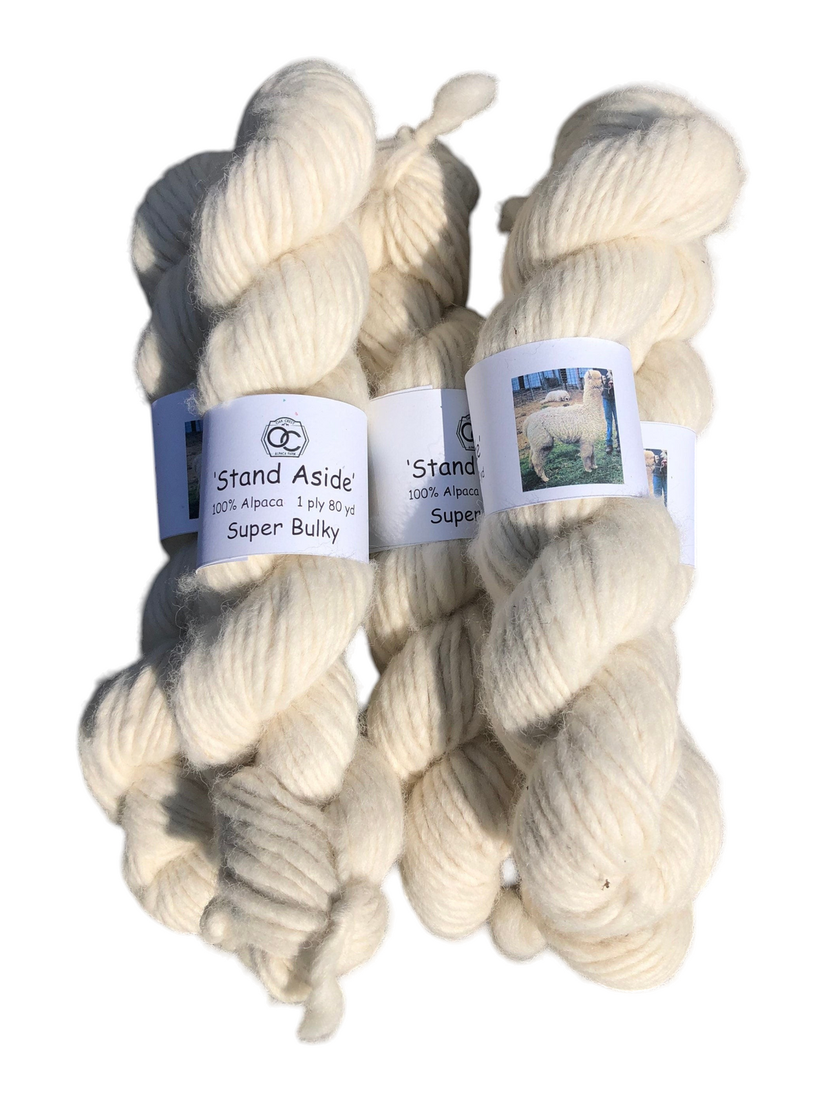 Oak Crest Alpacas and More white super bulky 100% alpaca yarn skeins in a rustic single ply lopi style